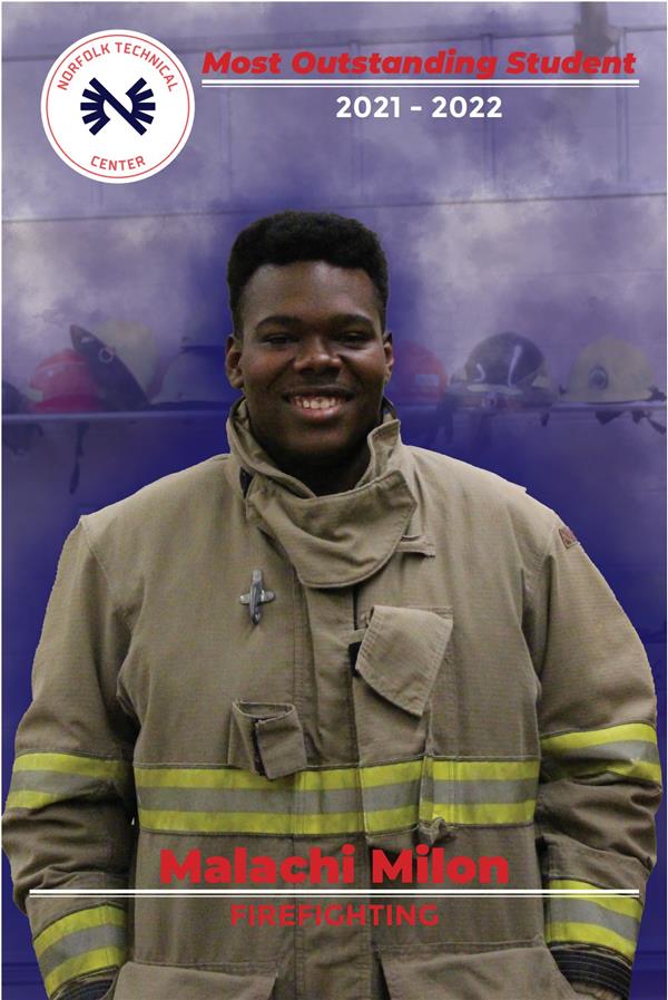 Picture of student in fire fighter coat with a firefighter background